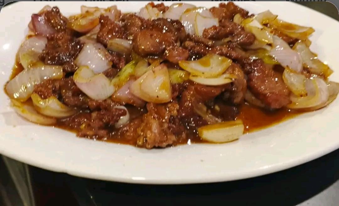 68 Fried Beef with Onions.